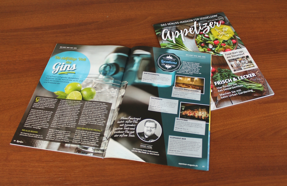 Aufgeschlagenes Genuss-Magazin mit Artikeln über Gin und lokale Bars. Projekt: Appetizer Genuss-Magazin Düsseldorf beim Textquartier Marius von der Forst.